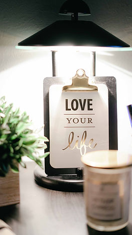 A clipboard with a sign that says love your life as a reminder to find your flow