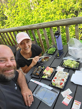 Kori enjoying sushi with her husband while balancing food freedom with weight loss and body composition goals