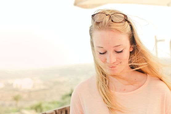 woman looking down and reflecting on her choices