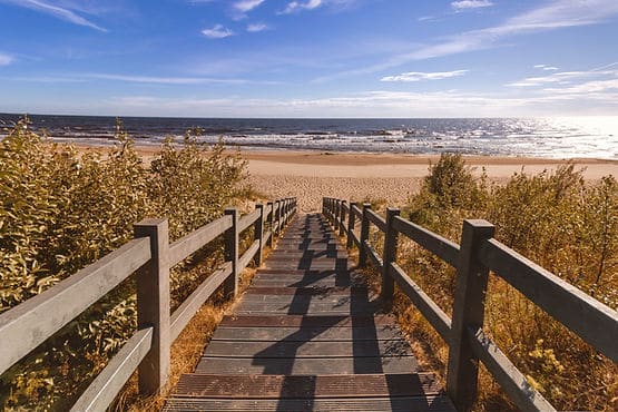 walkway leading to the vast expanse of the sea