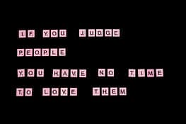 sign telling us that if we judge people, we have no time to love them
