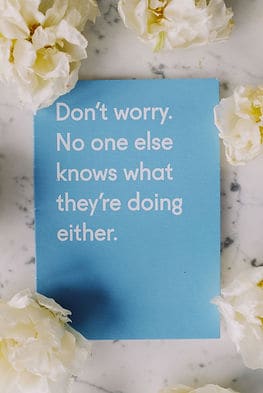 A sign that says "Don't worry. No one else knows what they're doing either." Most of us are unaware of how to feel more motivated.