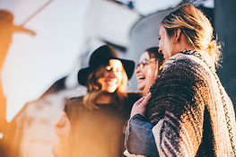 Three women working as a team and taking accountability for each other's success.